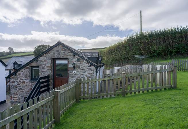The lawn area provides a fully enclosed garden once the gate is closed.