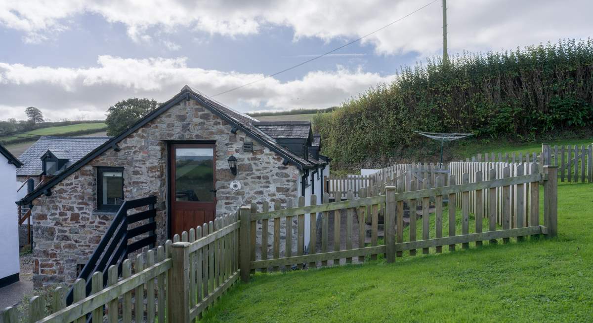 The lawn area provides a fully enclosed garden once the gate is closed.