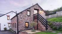 Head up the steps to Gull Cottage.