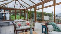 The grandparents can relax in the shared conservatory whilst the parents and children enjoy the pool.