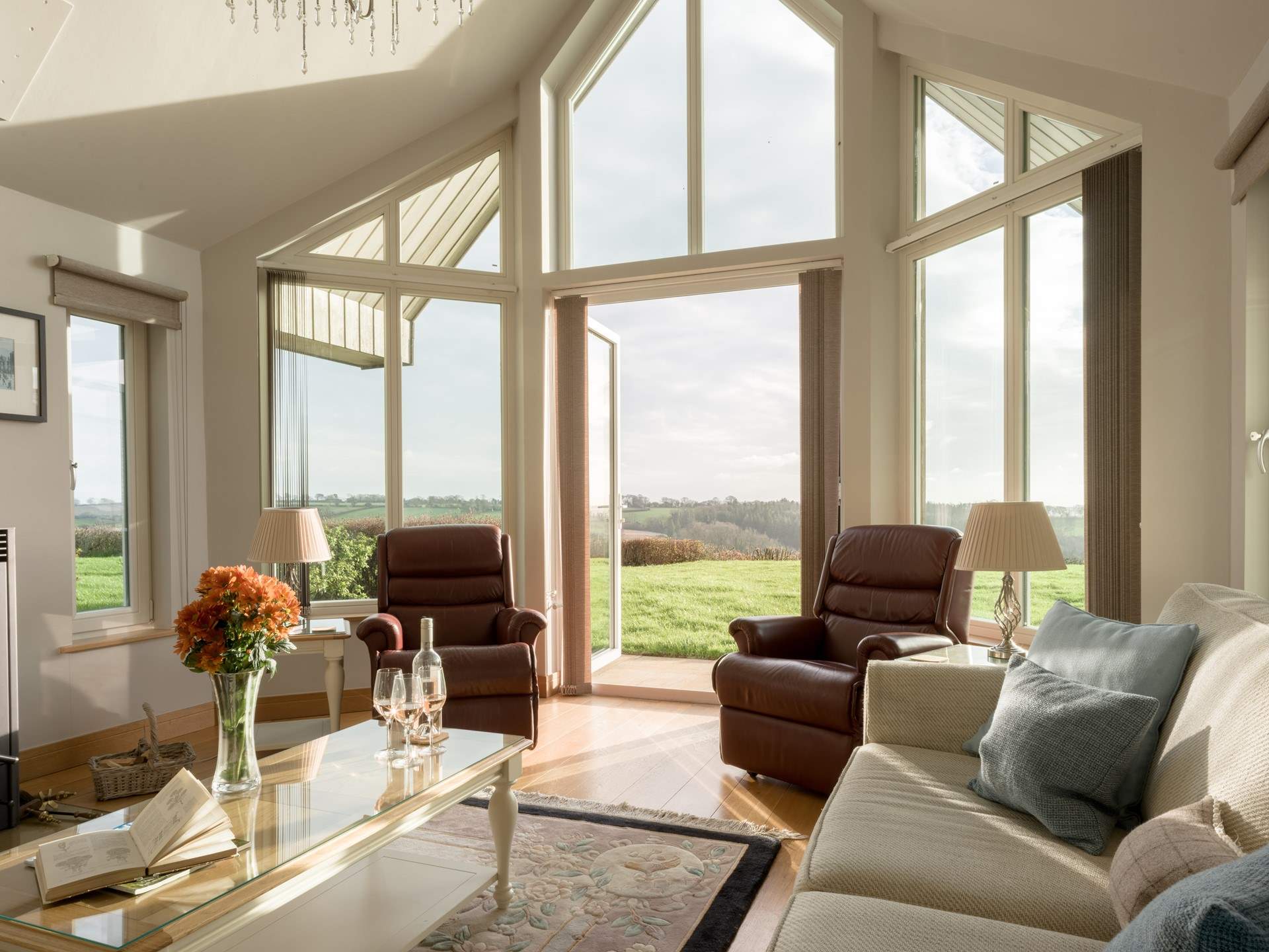 The vaulted living-room is quite the space with a pair of reclining armchairs, a lovely large sofa and the all important wood-burner. Just perfect for a relaxing afternoon and evening...