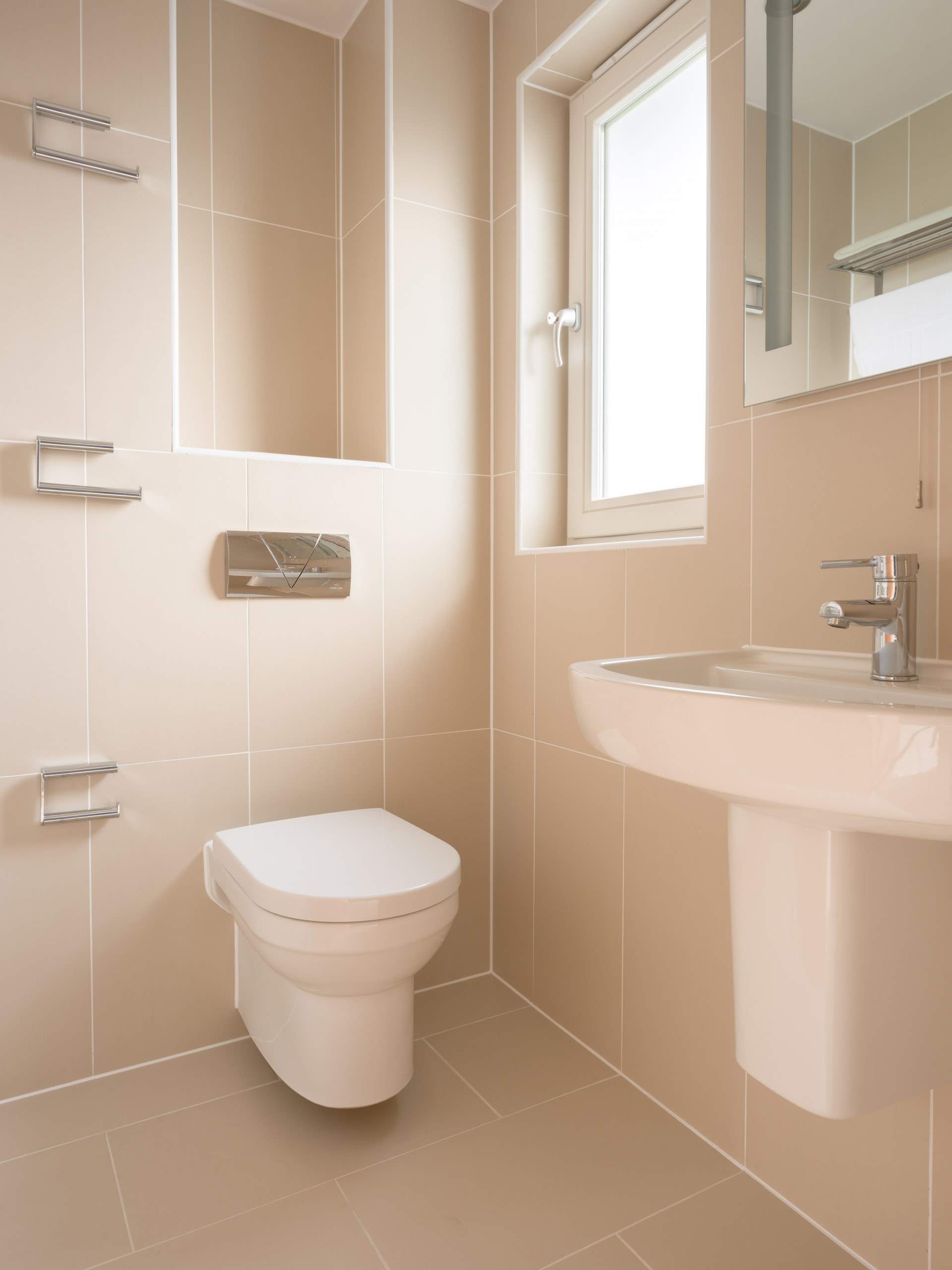 The en suite for bedroom 1 is spacious and light.