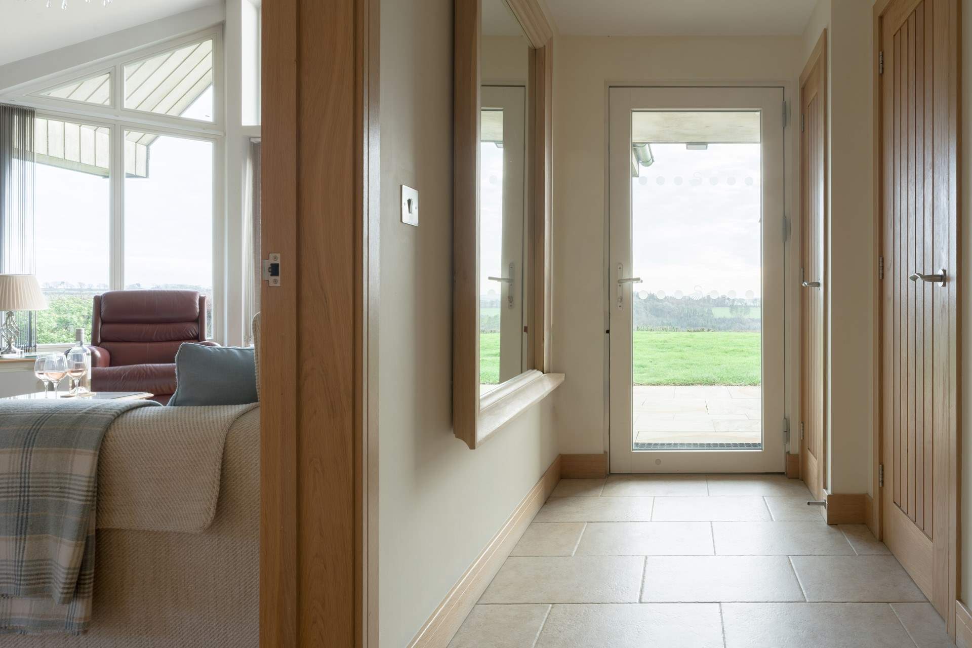 You enter into a lovely spacious hallway off the rear patio.