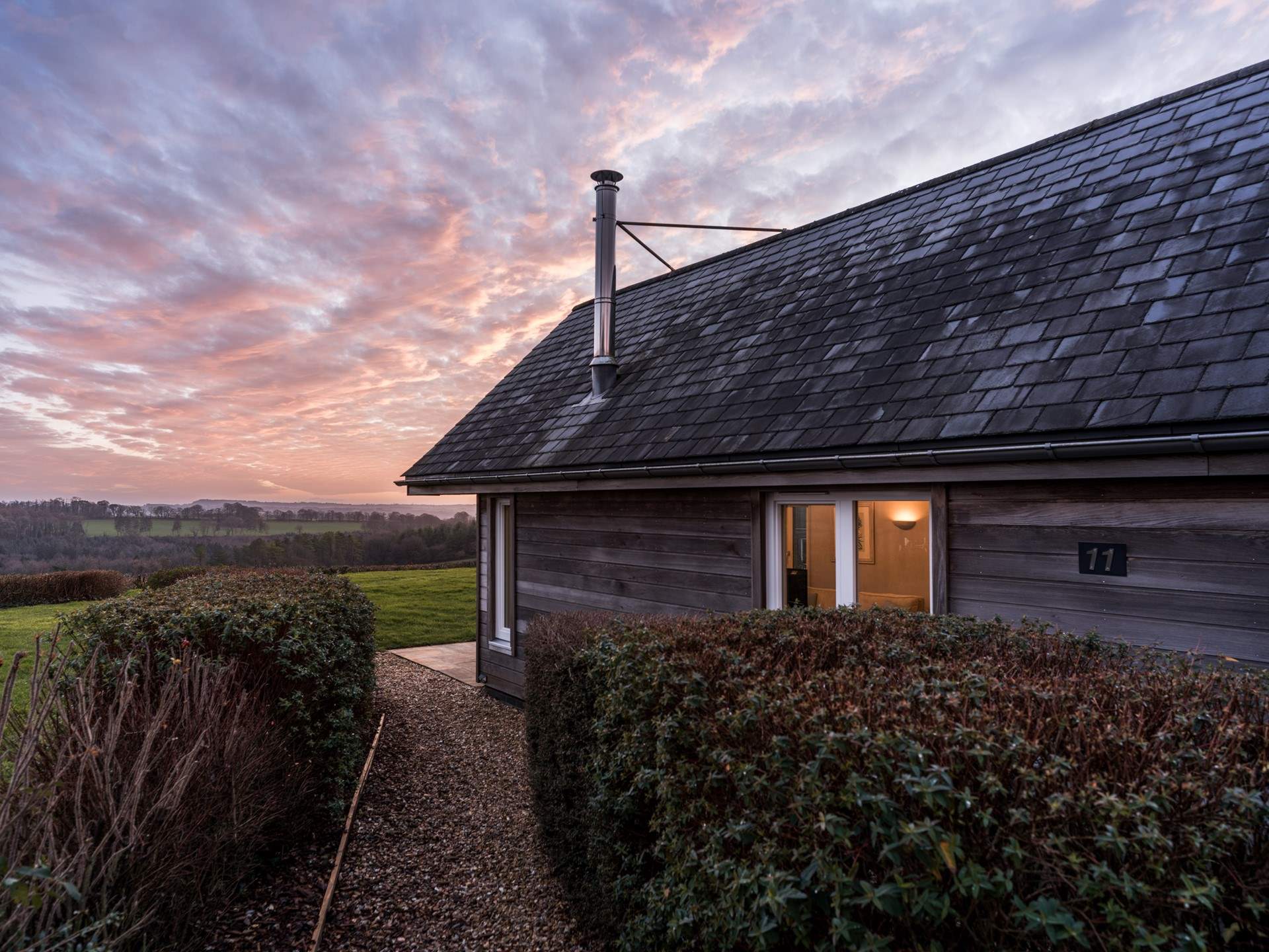 A short path leads from the private parking area.