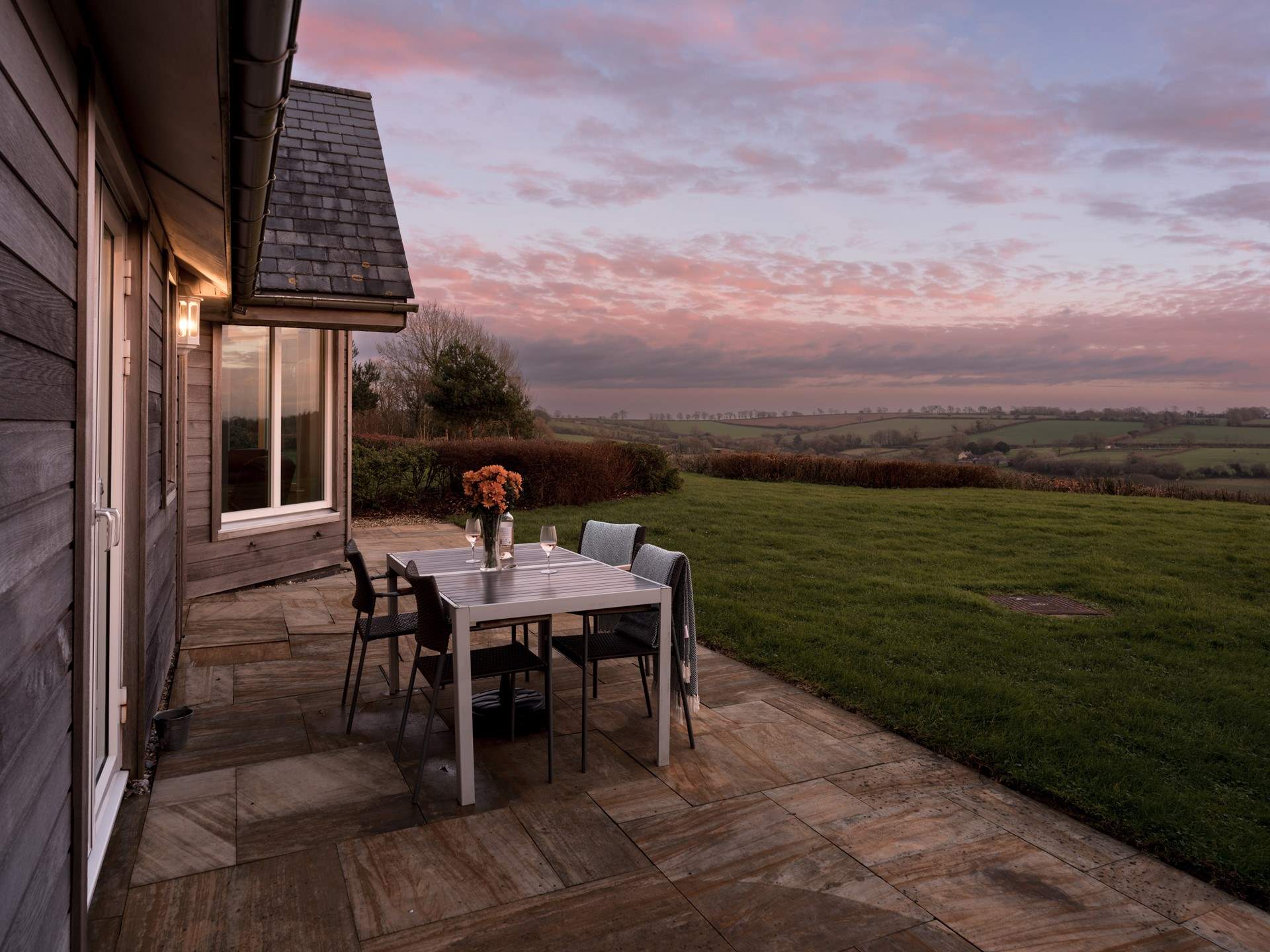 The patio-area is a little bit special. Spacious with seating, sun-loungers and a barbecue. Expect to spend a lot of time here drinking in the views across the fields towards the famous Cricket St Thomas estate.