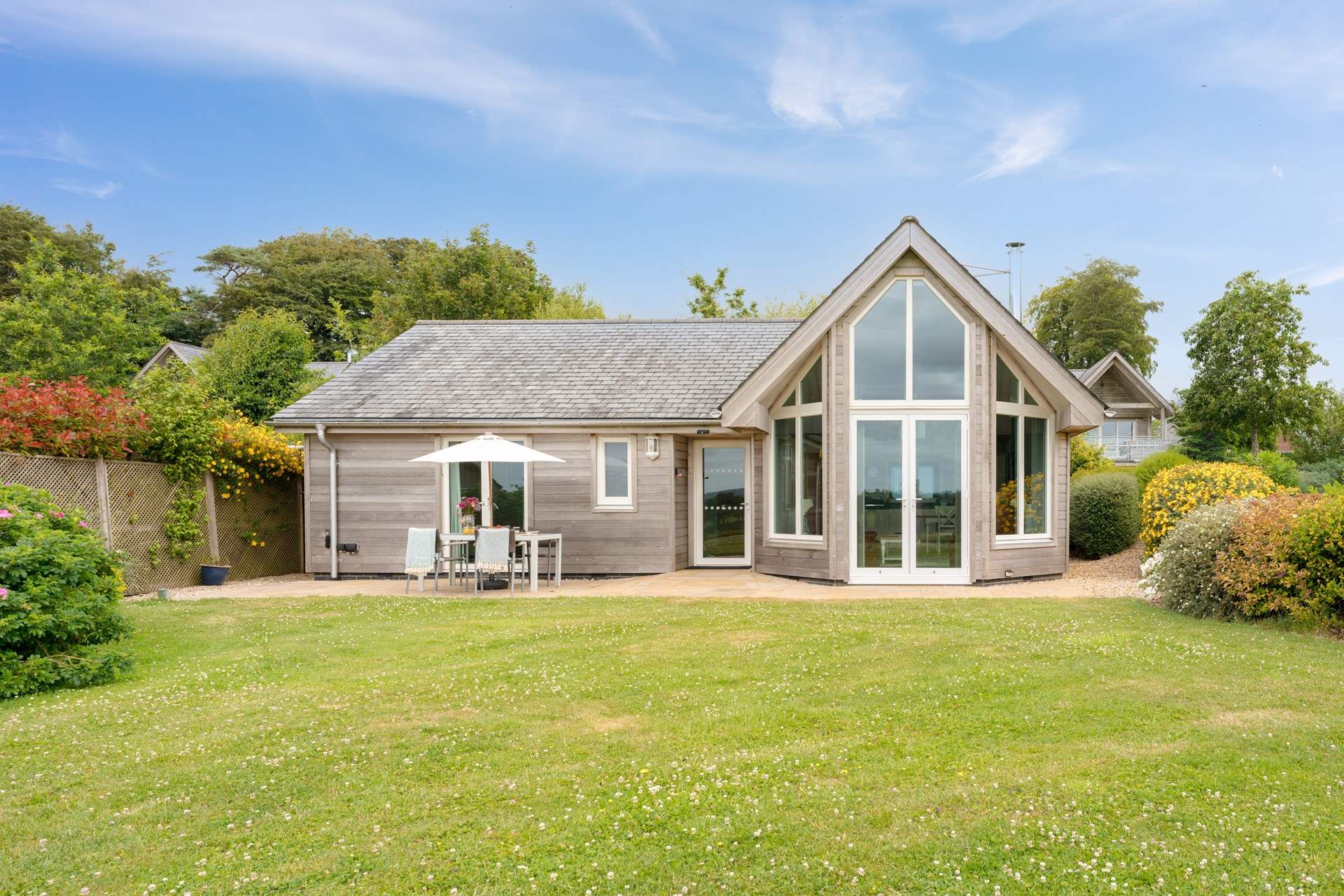 Welcome to the spectacular The Cygnet - Lodge 11. A purpose-built luxury Scandinavian style holiday home set in the most glorious sylvan surroundings on the famous Cricket St Thomas estate.