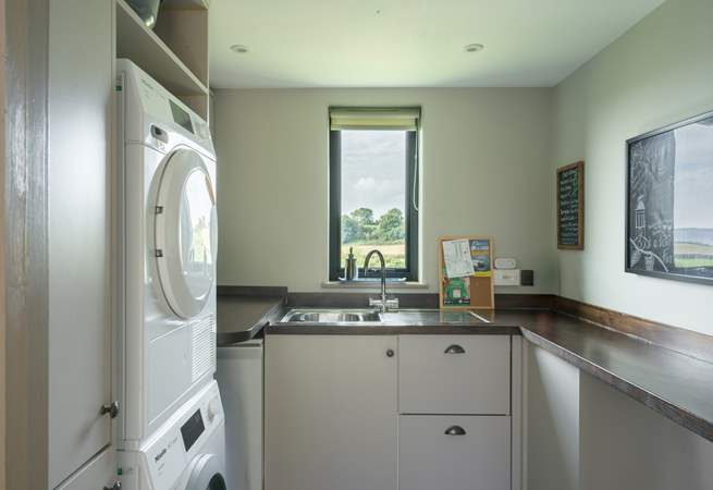 The ever useful separate utility-room has a washing machine and tumble-drier.