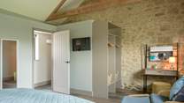 Storage and hanging space galore as well as a spot to sit and read.