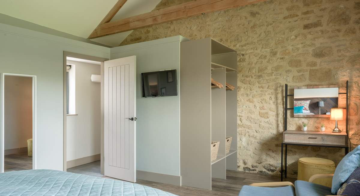 Storage and hanging space galore as well as a spot to sit and read.