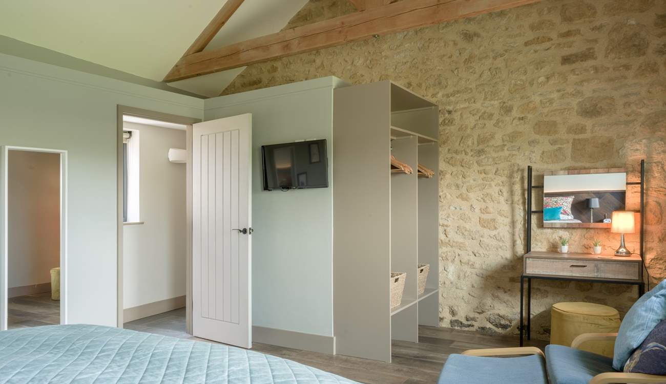 Storage and hanging space galore as well as a spot to sit and read.