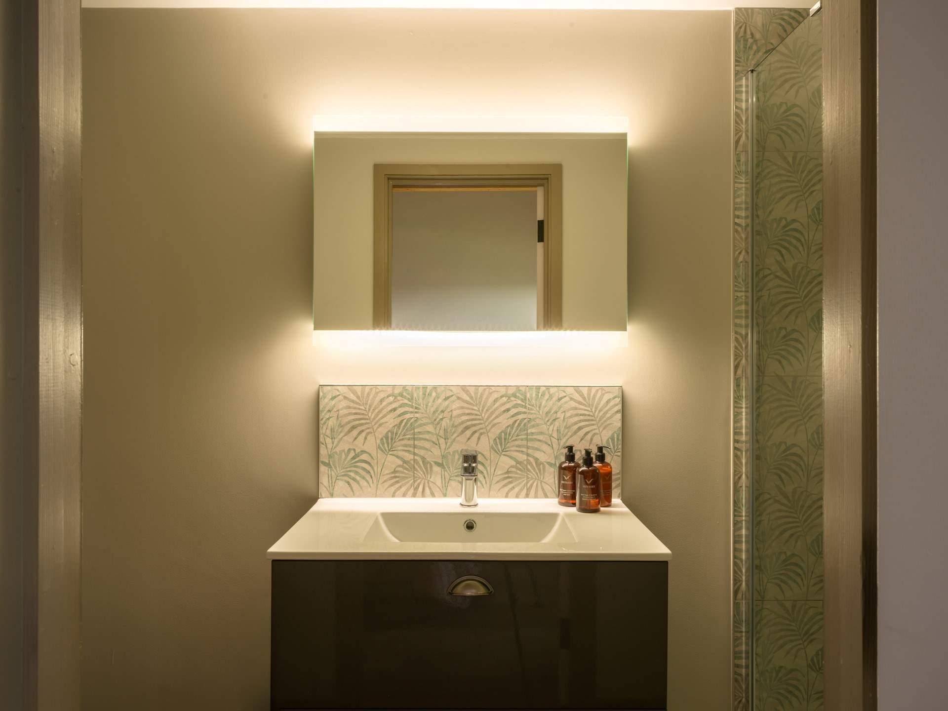 The en suite is another example of the five star feel throughout the property and features a large shower enclosure with rainfall shower head.
