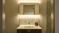 The en suite is another example of the five star feel throughout the property and features a large shower enclosure with rainfall shower head.