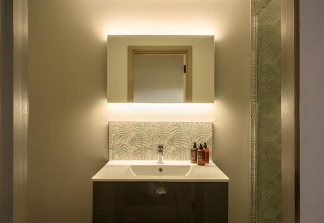 The en suite is another example of the five star feel throughout the property and features a large shower enclosure with rainfall shower head.