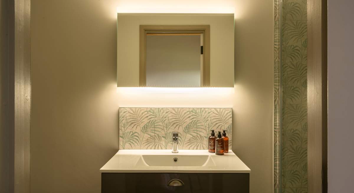 The en suite is another example of the five star feel throughout the property and features a large shower enclosure with rainfall shower head.