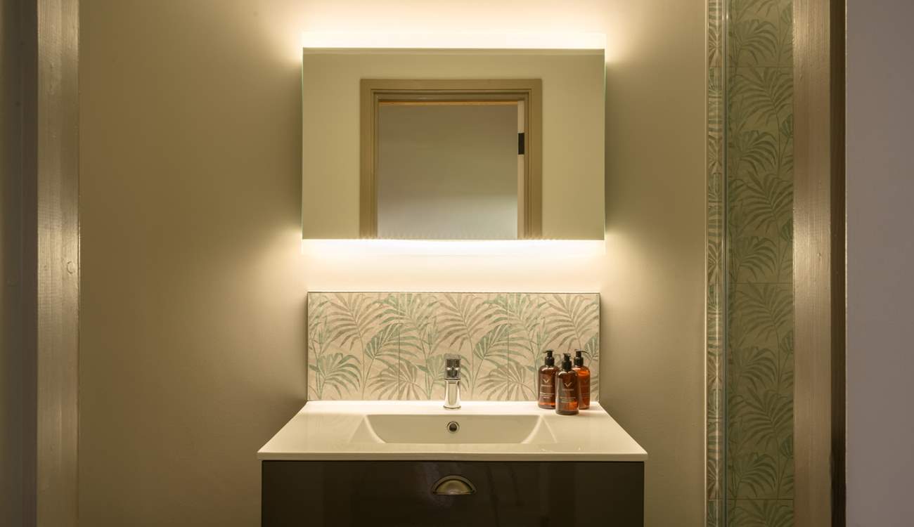 The en suite is another example of the five star feel throughout the property and features a large shower enclosure with rainfall shower head.