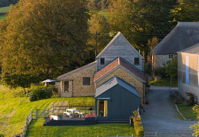 Hood's has its own private enclosed garden as well as further grounds to explore. Just over the top you can see the sister property - Loaf At The Granary, also available to book.