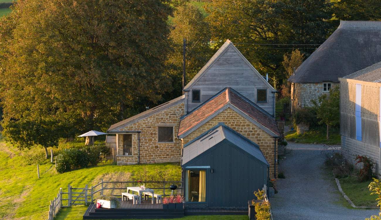 Hood's has its own private enclosed garden as well as further grounds to explore. Just over the top you can see the sister property - Loaf At The Granary, also available to book.