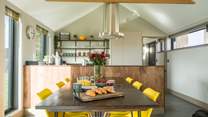 The stunning vaulted open plan living space is perfect for group get togethers or couples' getaways.