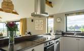 The kitchen is fully equipped and makes for a wonderful social dining environment - Thumbnail Image