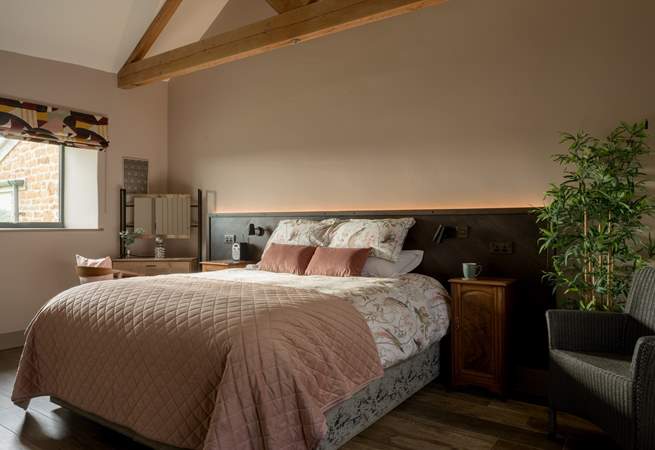 The primary bedroom is serene with a super-king size bed (can be split into two twins) and luxurious linen.