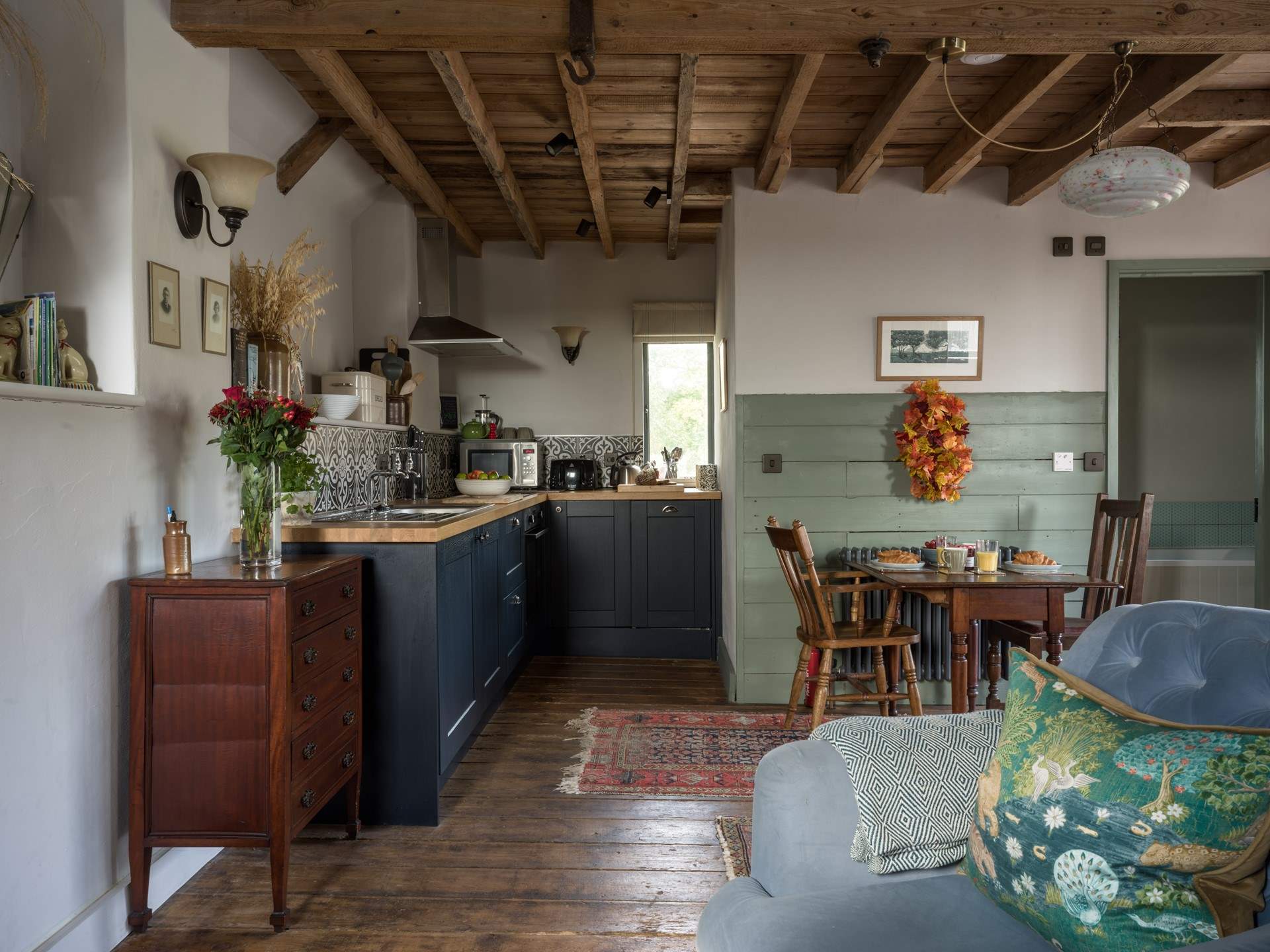 The living space is cosy and comfortable with a lovely little dining spot.