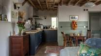 The living space is cosy and comfortable with a lovely little dining spot.