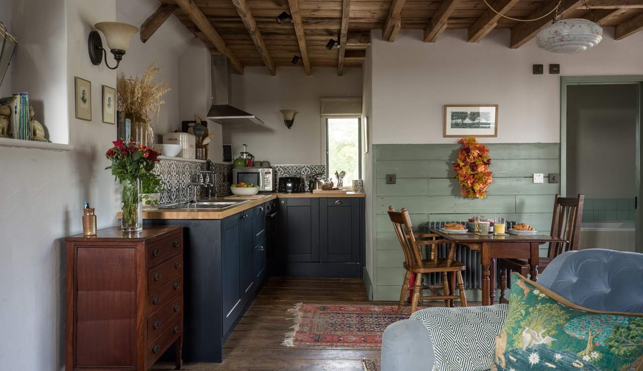 The living space is cosy and comfortable with a lovely little dining spot.