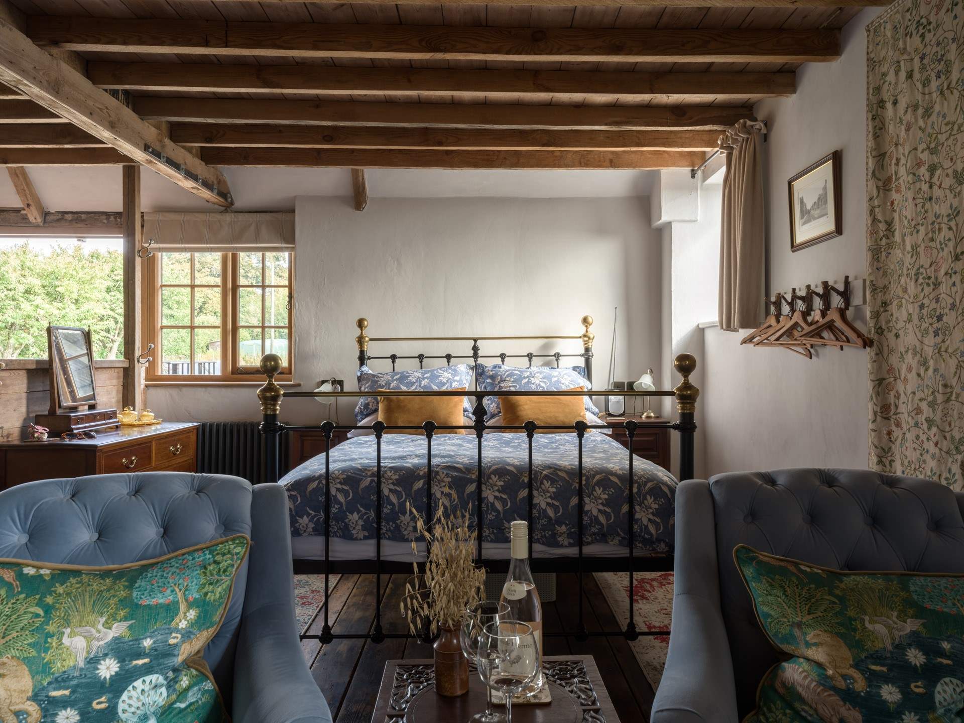 The king-size bed is beautifully presented with luxurious linens. You will sleep well here.