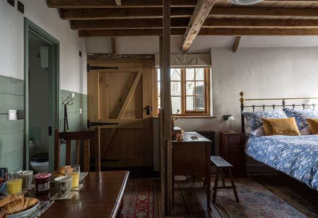 So much of the original character and features are still on show. To the left of the living space is the luxury bathroom.