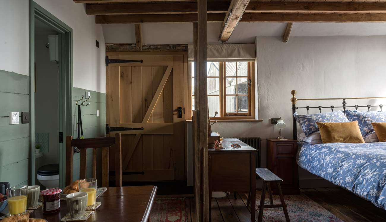 So much of the original character and features are still on show. To the left of the living space is the luxury bathroom.