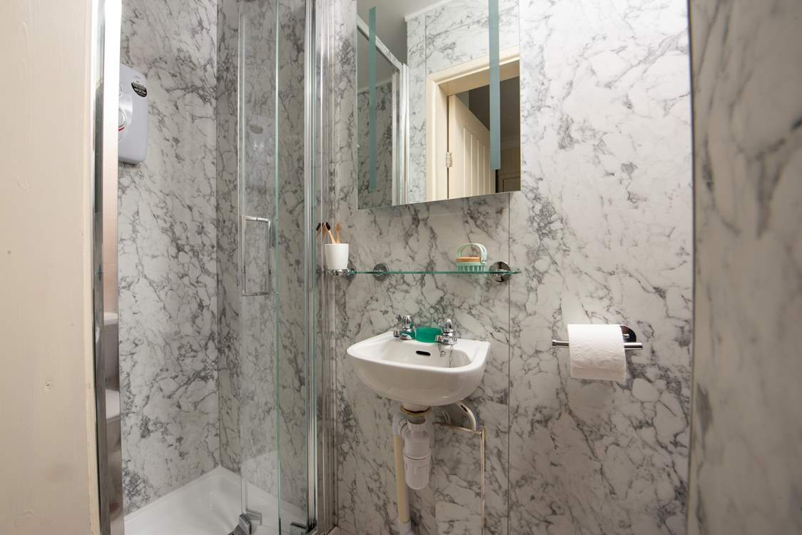 The sleek en suite to bedroom 2. Please note the shower door is narrow.