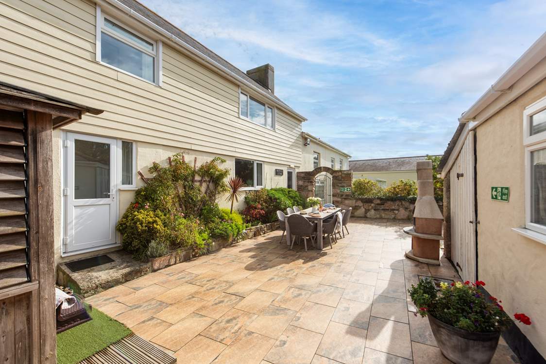 Your spacious patio, with hot tub, outdoor dining and Chiminea barbecue.