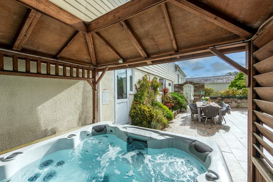 The hot tub has its own canopy.