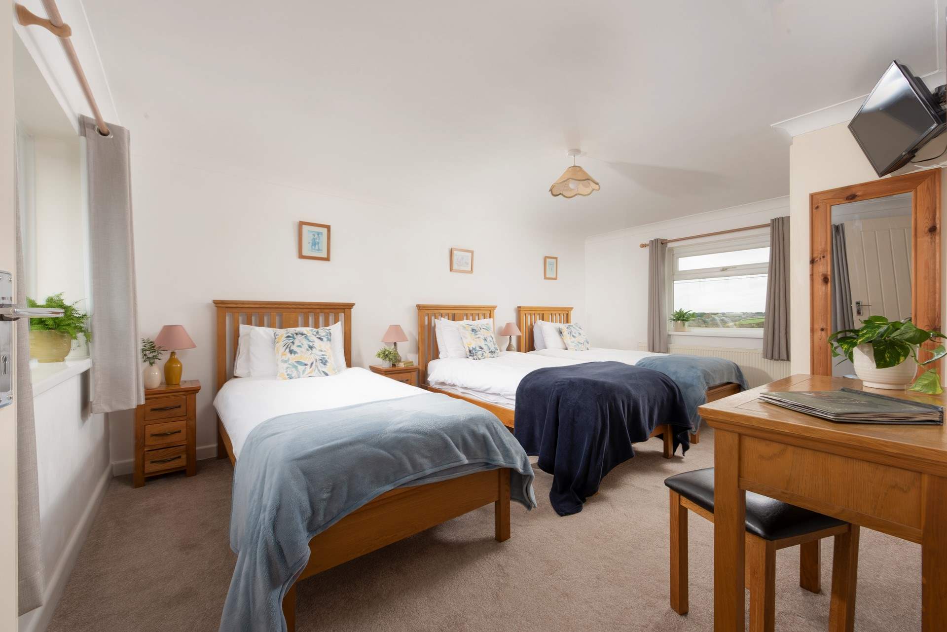There are three full-sized single beds in this fun triple room.
