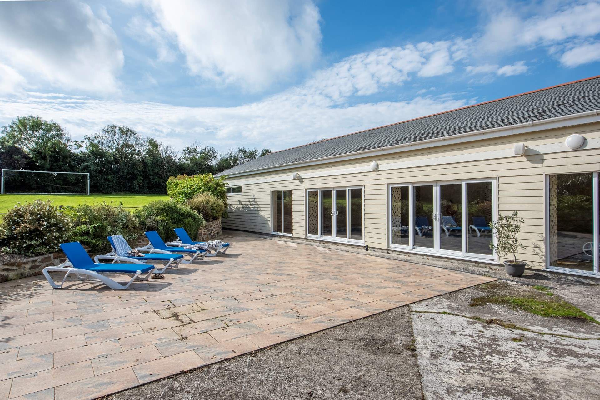 The sunny verandah outside the swimming pool.