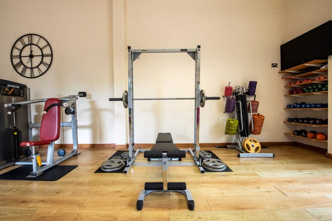 The gym is exclusive to holiday guests and has a squat rack, free weights and machines.