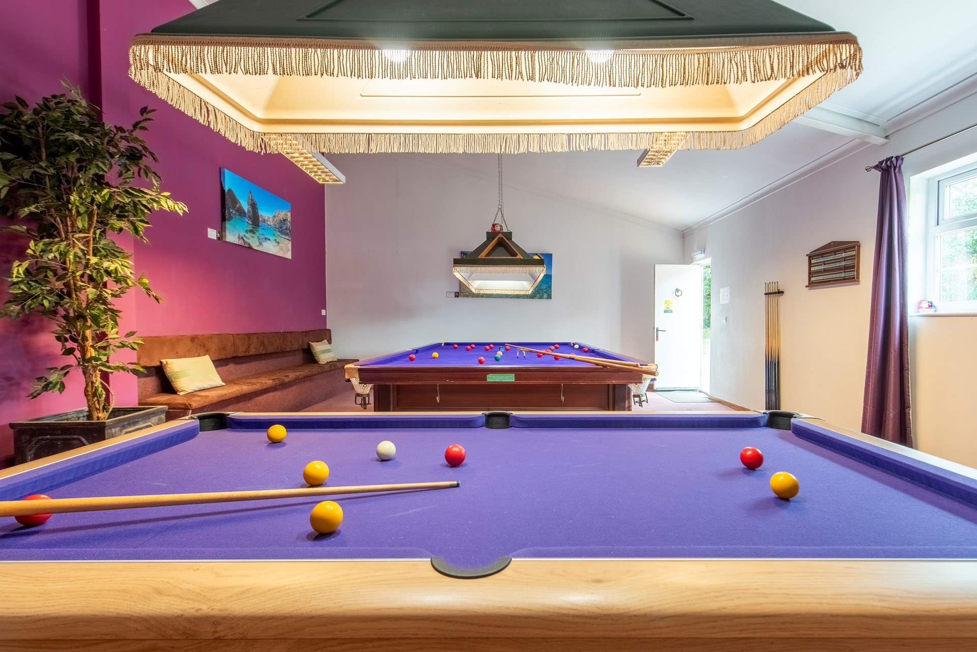 There is also a pool-table in this room with everything provided.