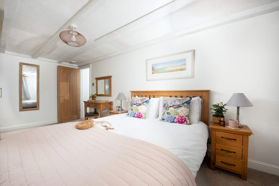 This large king-size bedroom is perfectly appointed.