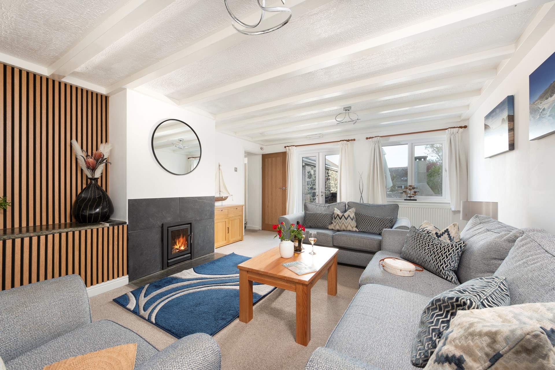 The sitting-room has French doors that open up to the patio.