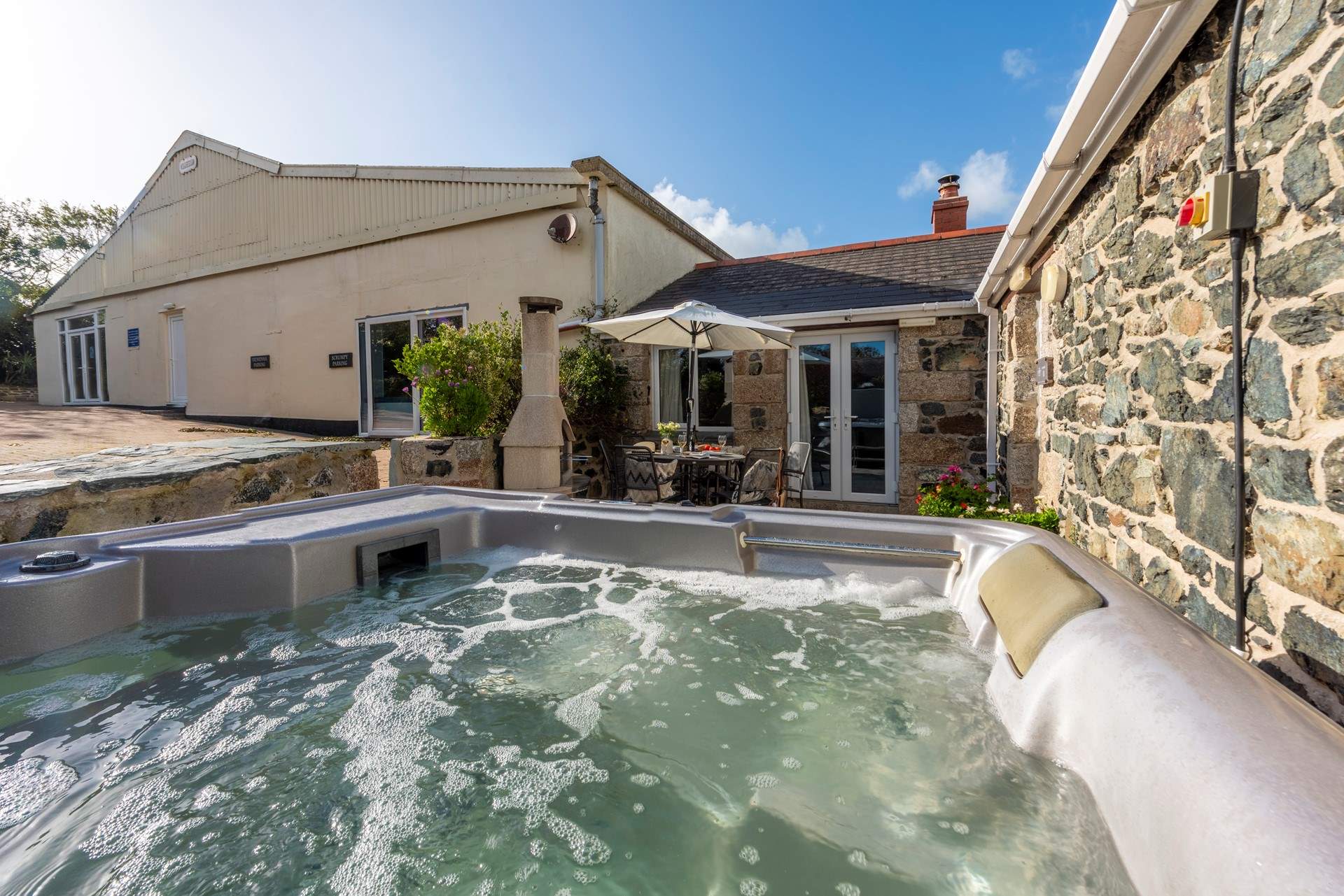 The hot tub is big enough for the whole party to enjoy. 