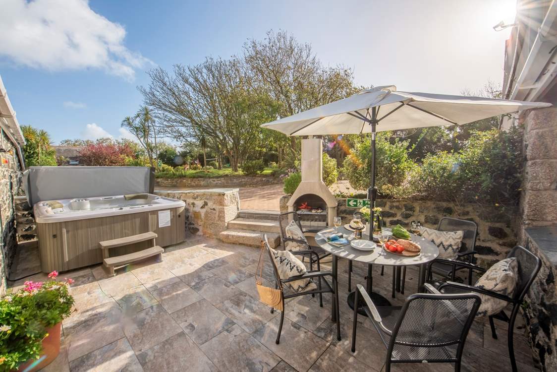 The outdoor space is a little suntrap, with its own chiminea barbecue and hot tub.
