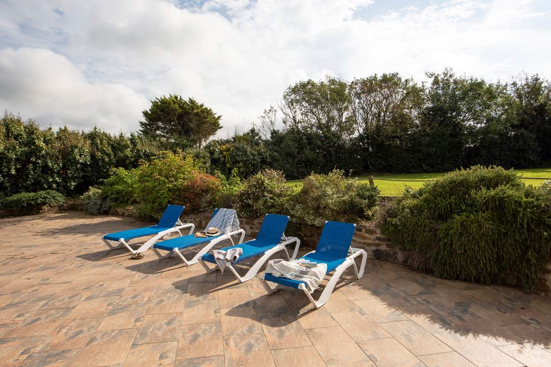 The sunny veranda outside the pool house.