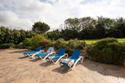 The sunny veranda outside the pool house.