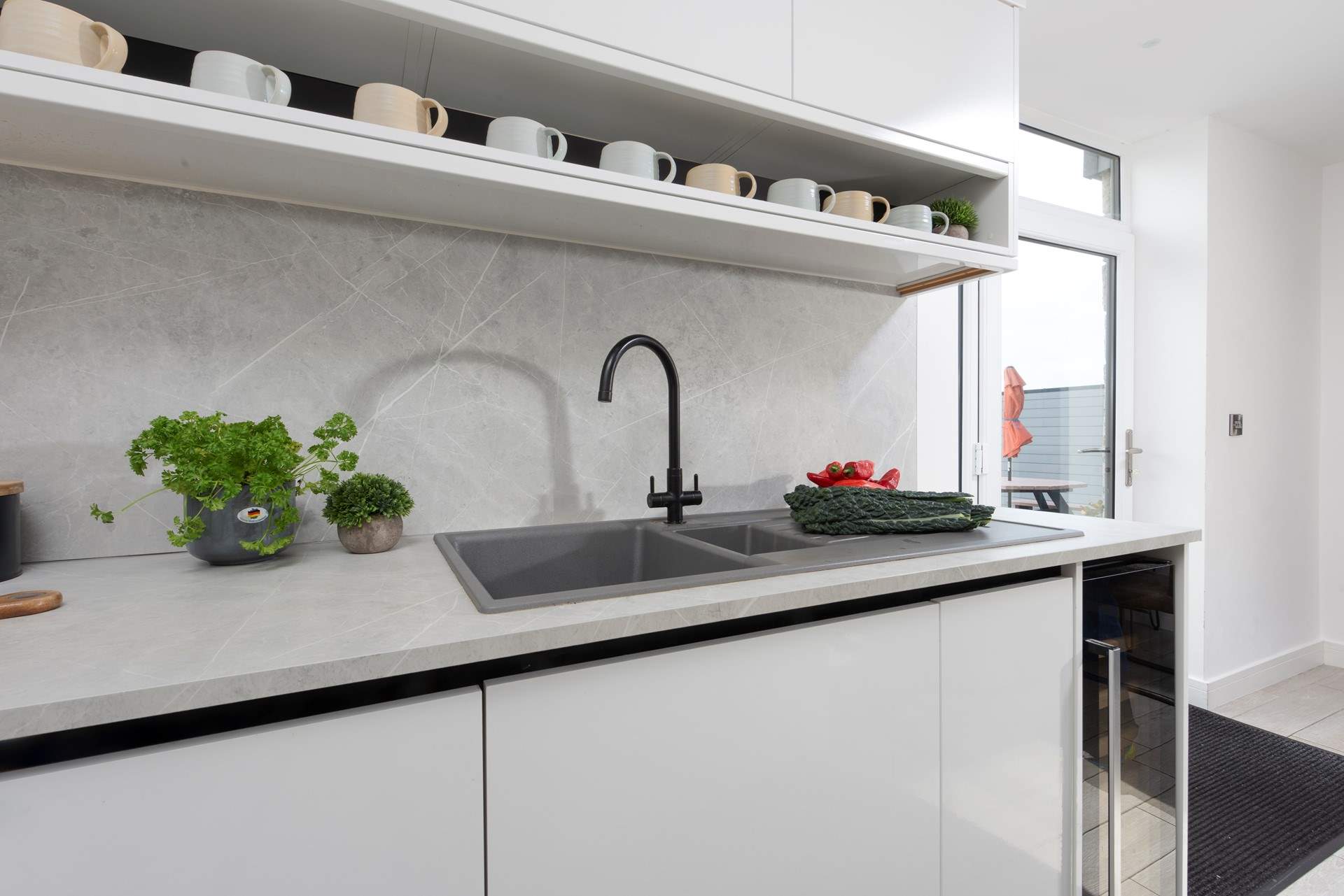 The kitchen has doors to access your garden.