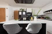 The breakfast bar is perfect for social cooking.