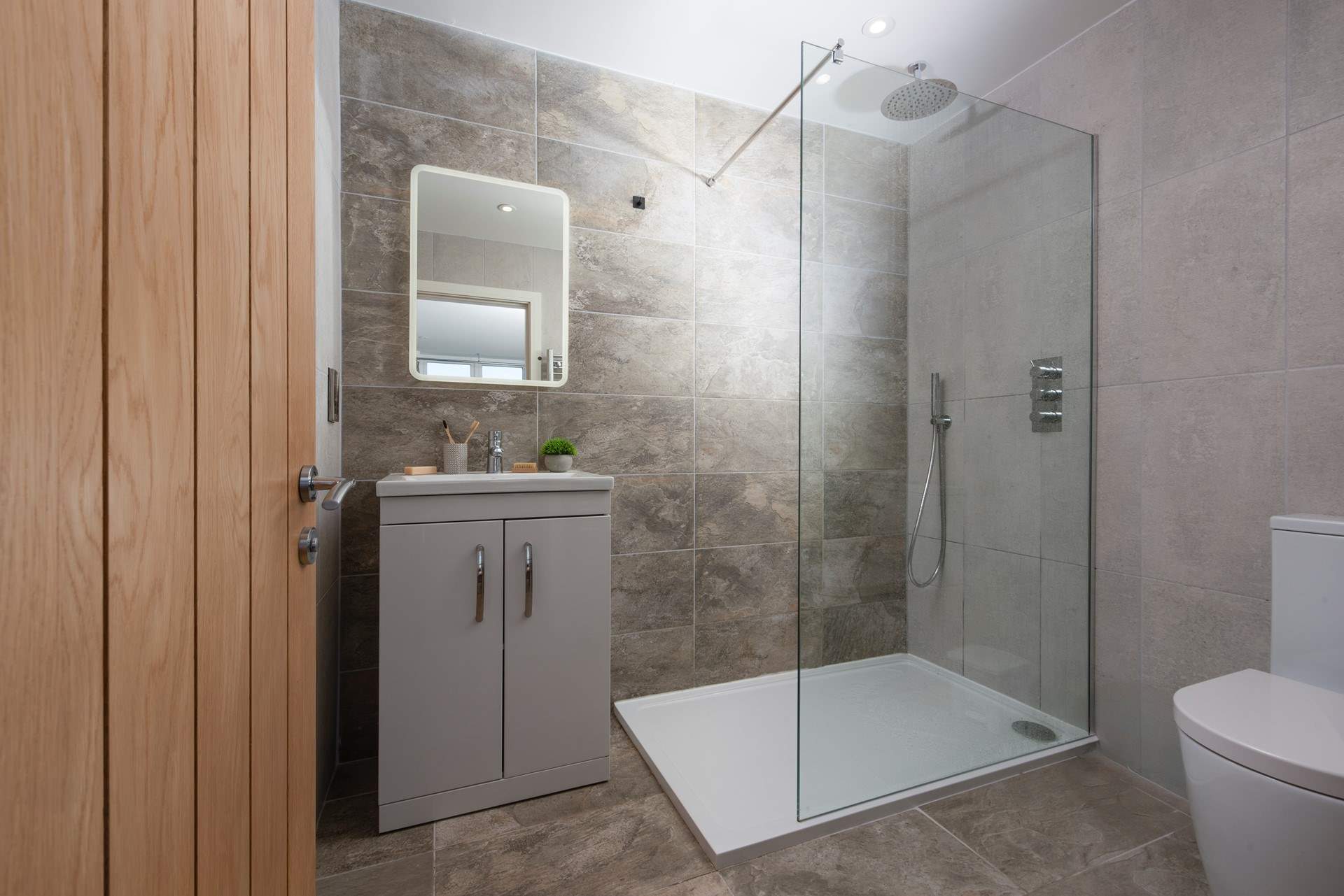 The ground floor shower-room with large shower tray.