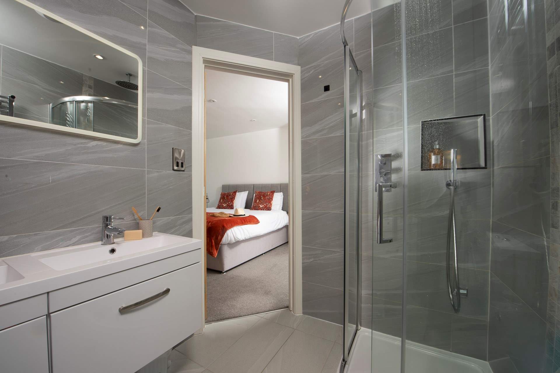 The en suite to bedroom 4 has a double basin.