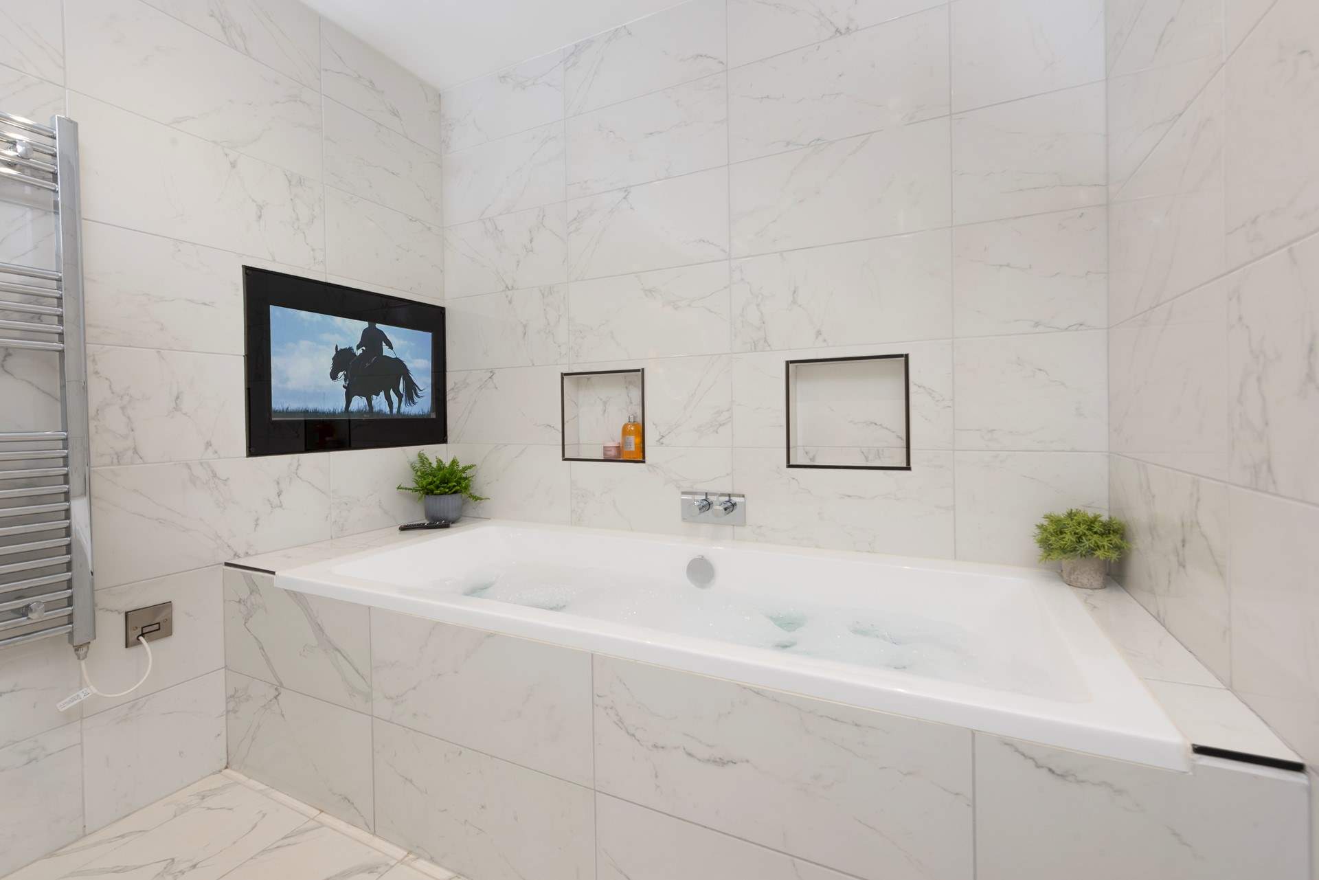 There is a TV over the bath!