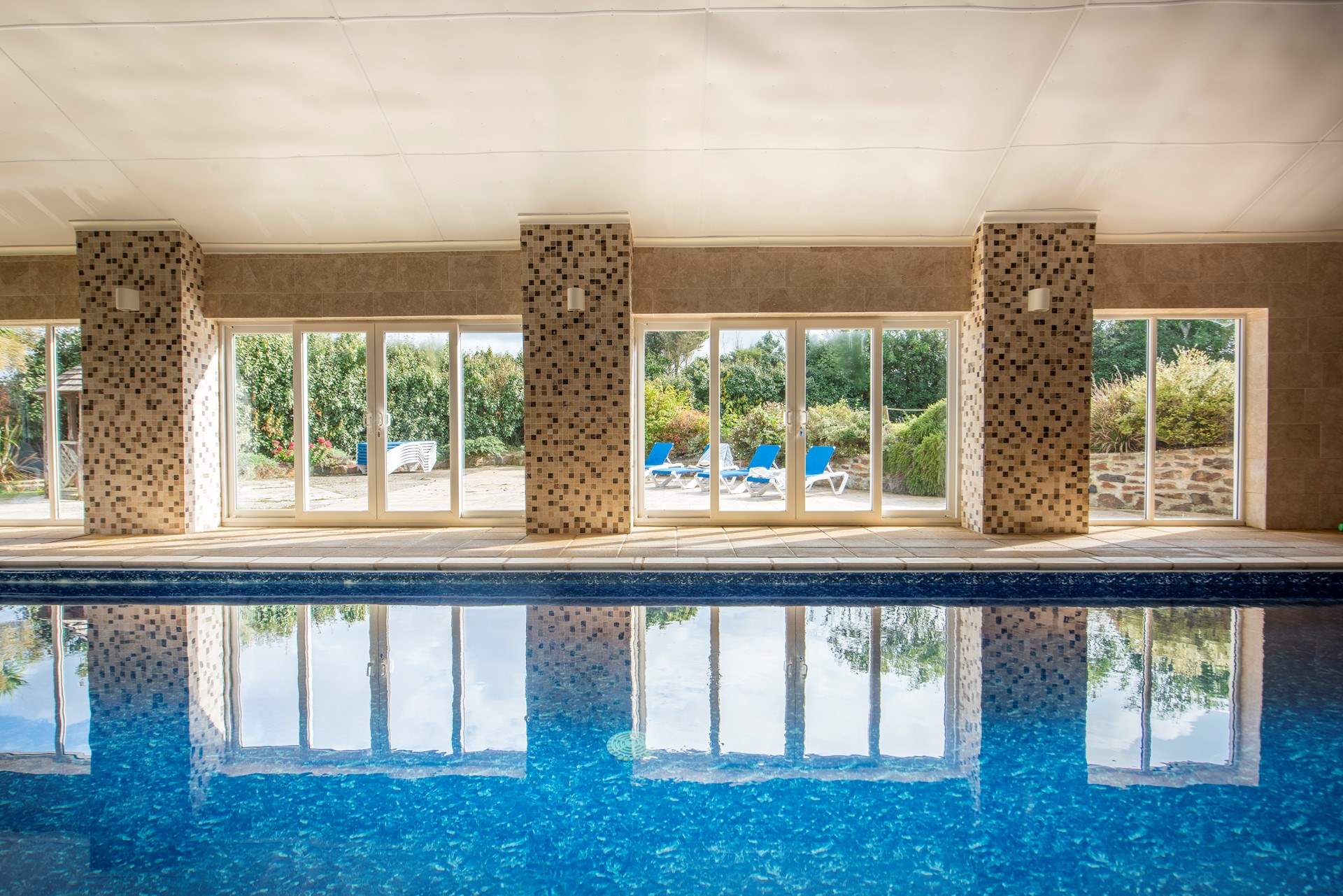 The heated swimming pool is shared with three other cottages on site.