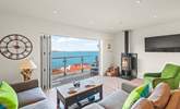 The living-room offers the most stunning views out to sea and beyond. - Thumbnail Image
